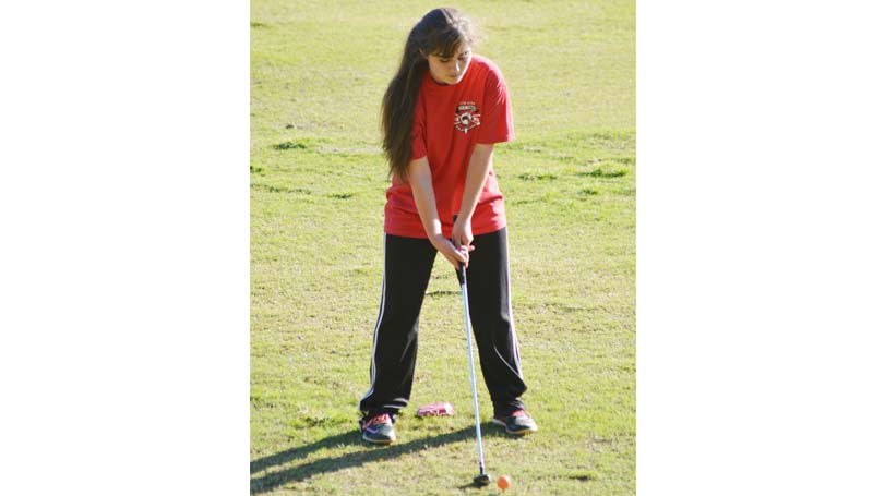 Daily Leader / Chris King / Loyd Star Lady Hornets' medalist Courtney Wyant prepares to drive the ball against Wesson and Prentiss.