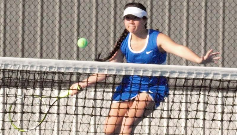Daily Leader / Tracy Fischer / Wesson's Kimberly San prepares to return a serve in girls' singles action Monday against Magee.