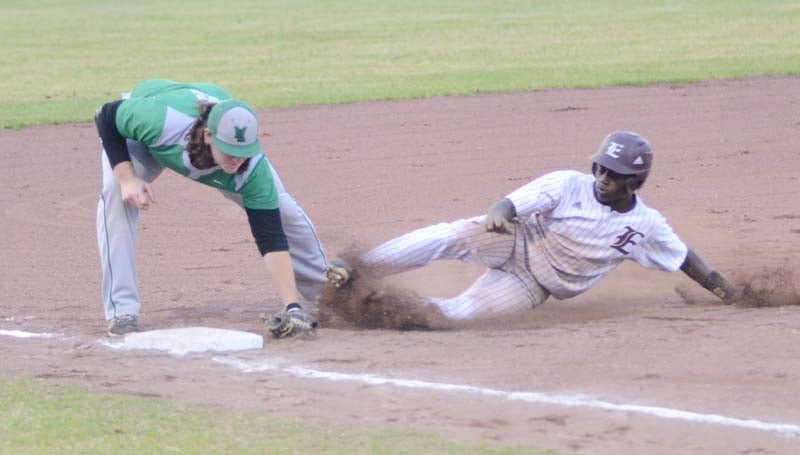Daily Leader / Marty Albright / West Lincoln's Seth Bivens (left) tags out Enterprise runner Marvin Butler stealing third base Tuesday night.