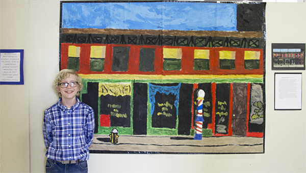 Photo by Alex Jacks / Seventh grader Sam Allen stands with his reproduction of Edward Hopper’s “Early Sunday Morning."