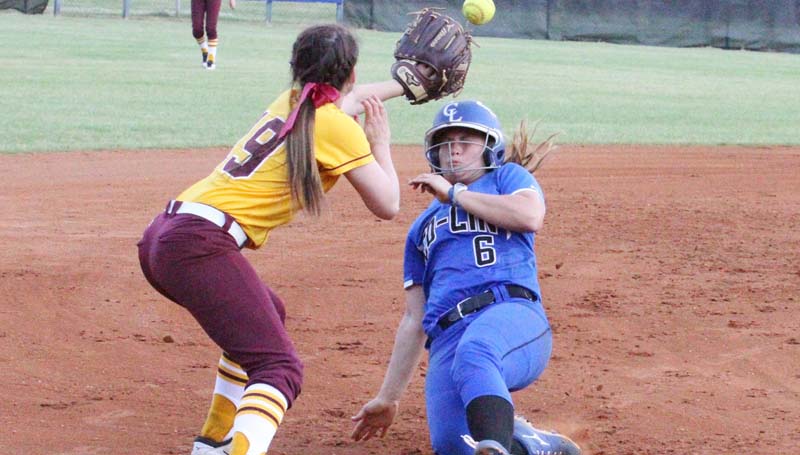 Co-Lin Media / Natalie Davis / Co-Lin's Kaitlyn Taylor slides under the tag of Pearl River third baseman Brooke Barnes.