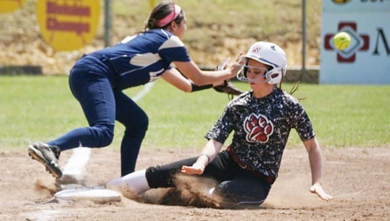 Daily Leader / Jana Harp / Lawrence County's Callie Fortenberry (7) slides in safely at third base against Franklin County on Saturday at Loyd Star.