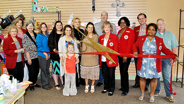 Photo by Kristi Carney / Wooden Cross Book and Gift Shop recently held its ribbon cutting. The store will be open Monday through Saturday 9 a.m. to 5 p.m. and is owned by Deborah and Gary Martin. Her children are Kala Ward and her son Cory and Jonathan and Kayla Martin, and her grandchildren are Andrew Martin, Carey Barnett and Jozalyn Martin.