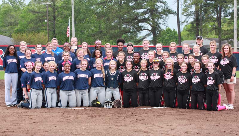 Daily Leader / Photo submitted / The Brookhaven Lady Panthers (left) and the Lawrence County Lady Cougars (right) pose together to recognize breast cancer awareness Tuesday night at the Ole Brook Lady Panthers Softball Complex.