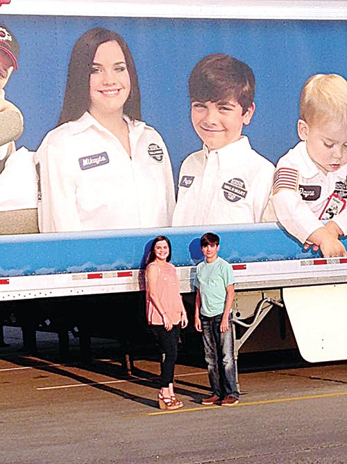 Photo submitted / Mikayla and Peyton Warren were recently featured on a Walmart Heart trailer. The nationwide Walmart Heart program was designed to make children or adults with health challenges feel special for a day. The program makes the guest of honors an honorary Walmart truck driver for a day. Seven Walmart heart trailers were created and will be driven all across the United States.