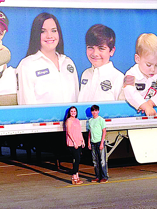 Photo submitted / Mikayla and Peyton Warren were recently featured on a Walmart Heart trailer. The nationwide Walmart Heart program was designed to make children or adults with health challenges feel special for a day. The program makes the guest of honors an honorary Walmart truck driver for a day. Seven Walmart heart trailers were created and will be driven all across the United States.