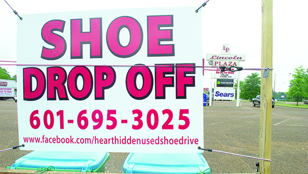 Photo by Aaron Paden / A drop-off point for the HeartHidden used shoe drive is located in the Lincoln Plaza parking lot in Brookhaven.