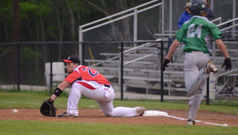 Daily Leader / Marty Albright / Loyd Star first baseman Bradyn Brister (left) makes a great scoop to record the out as West Lincoln's Kylar Fielder (24) hustles to beat the play at Smith Field.