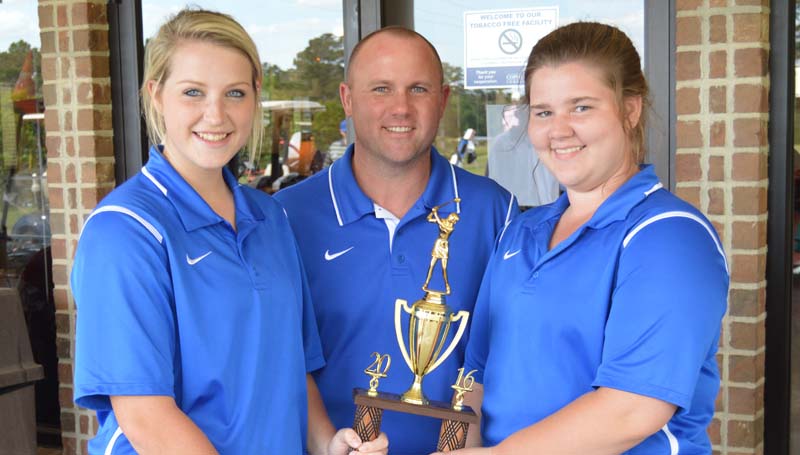 Daily Leader / Chris King / The Wesson Lady Cobras won the District Golf Tournament at Wolf Hollow Monday. Pictured (from left) Kaitlyn Smith, Coach John Douglas and Carrie McSweyn.