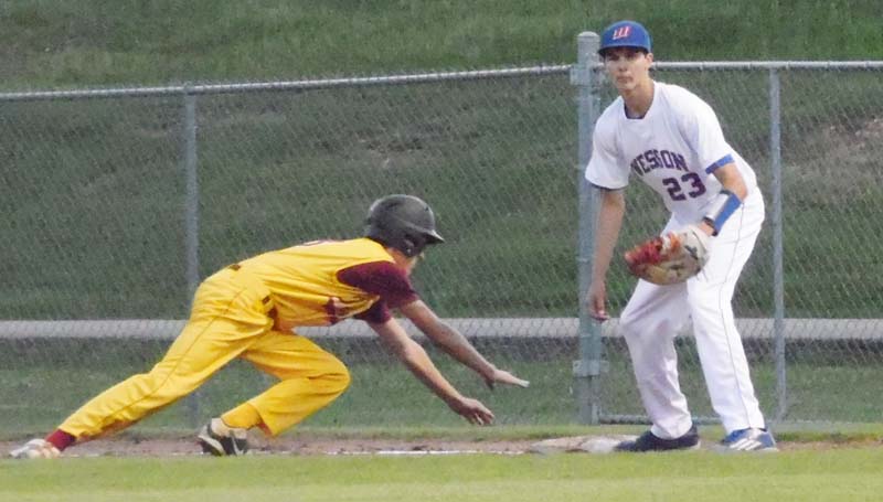 Daily Leader / Tracy Fischer / Wesson first baseman Alex Mooney waits on the throw as Perry Central's Pierson Adams dives back safely Friday night.