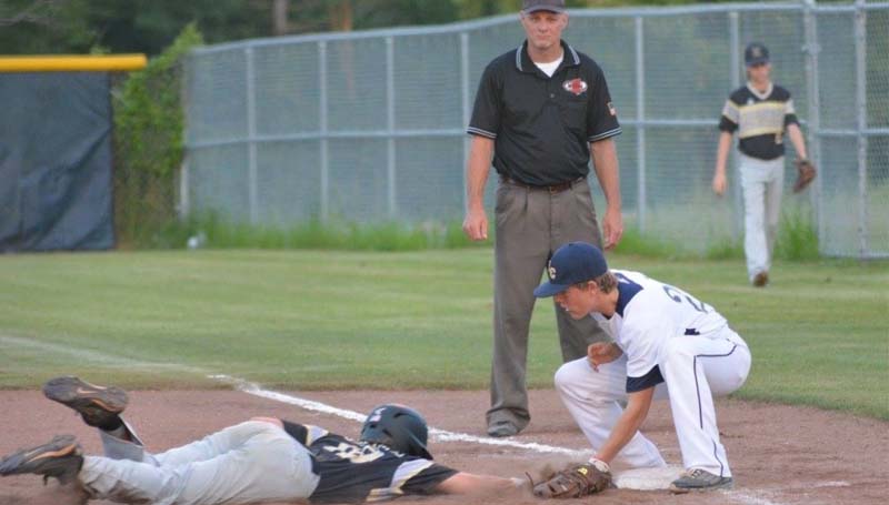 Daily Leader / Stacy Leake / Bogue Chitto first baseman Connor Price tags out and Resurrection runner diving back to first on a pick off play Monday night.