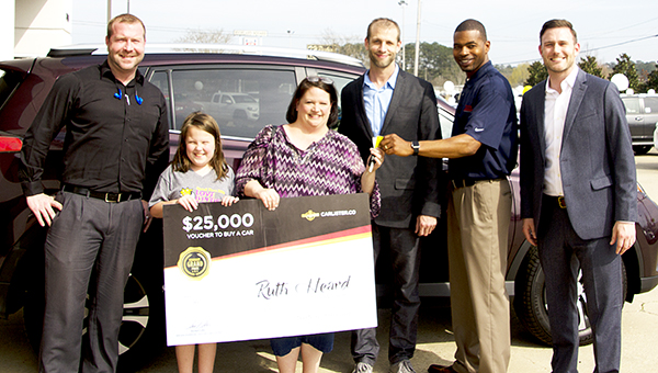 Photo by Alex Jacks / Toyota of Brookhaven recently participated in a car giveaway. Pictured are(from left) Kevin Campbell, internet director; Ruth Heard and her daughter, winner of car; Brian Harmon, CEO of Carlister.com; Dino Evans, sales consultant at Toyota of Brookhaven; and Prentiss Smith general manager at Toyota of Brookhaven.