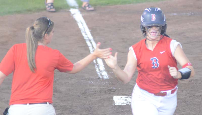 Daily Leader / Marty Albright / Brookhaven's Katherine Shell receives a high-five from her coach Mandy Vinson (left) along third base line after hitting a two-run homerun in the sixth inning against West Harrison.