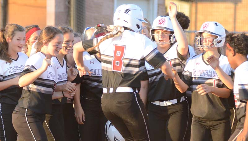 Daily Leader / Marty Albright / Lawrence County's Sydney Pevey (8) is greeted at home plate by her teammates after hitting a two-run homerun in the fifth inning against North Pike.
