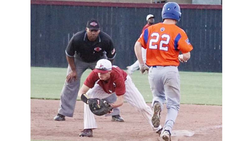 Daily Leader / Jana Harp / Lawrence County's first baseman Josh Stephens makes a tough catch to record the out against Newton County.