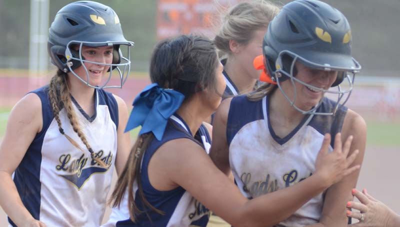 Daily Leader / Marty Albright / Bogue Chitto's Terrah Nelson is greeted at home plate by her teammates after hitting a two RBI triple and scored on a throwing error in the top of the sixth inning against Smithville at Freedom Ridge Park Thursday.