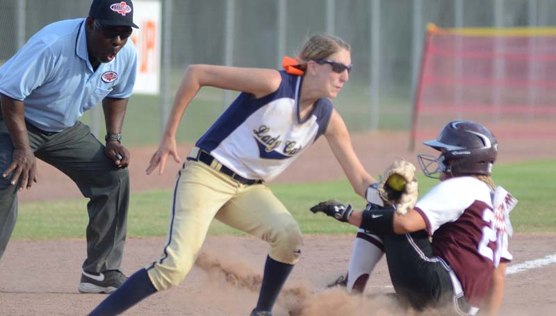 Daily Leader / Marty Albright / Bogue Chitto shortstop Terrah Nelson prepares to make a tag on Smithville runner Callie Williams sliding into third base Thursday.