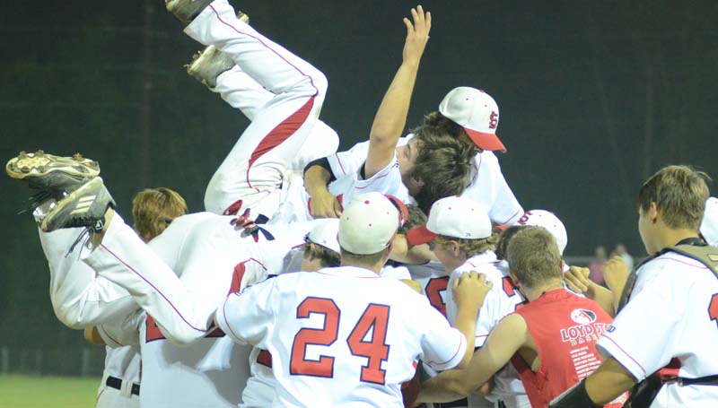 Daily Leader / Marty Albright / The Hornets celebrate their win with a team dog pile after sweeping the Bruins in two games Friday night.