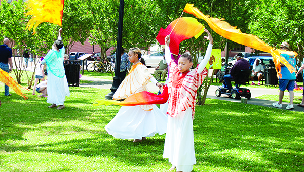 Photo by Aaron Paden / Lorenda Reese, Kristy Giddens, Angel Haynes, Alarria Townsend, Sierra Edwards and Zoe Hilliard with the Expressions of Praise Dance Ministry perform a dance in front of Mary Jane Lampton Auditorium at Brookhaven Animal Rescue League’s annual Barkfest fundraiser Saturday. Attendees were able to interact with several animals at the event.