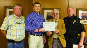 Photo by Alex Jacks / District 2 Supervisor Bobby Watts and District 4 Supervisor Eddie Brown present Matthew Springfield Jr., son of sheriff’s deputy Matthew Springfield Sr., with the Lincoln County 2016 Mississippi Association of Supervisors scholarship.