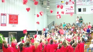 Loyd Star graduates celebrate their accomplishments by tossing their caps at the end of the Loyd Star Attendance Center graduation ceremony Friday. 