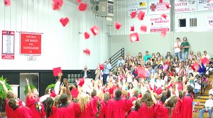 Loyd Star graduates celebrate their accomplishments by tossing their caps at the end of the Loyd Star Attendance Center graduation ceremony Friday.