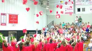 Loyd Star graduates celebrate their accomplishments by tossing their caps at the end of the Loyd Star Attendance Center graduation ceremony Friday. 