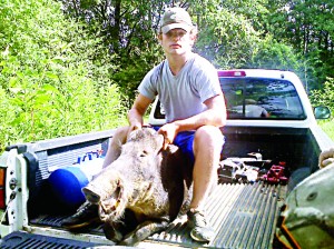 Photo submitted/Bryce Davis of Bogue Chitto loaded a wild boar in his truck after neighbors on Hog Chain Drive shot the 200-pound animal. 