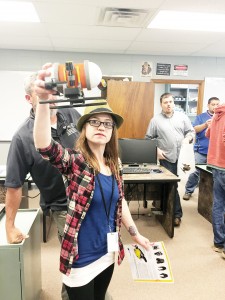 Photo submitted/Lauren Westrope displays a model of the Seawolf V to a group of students touring Copiah-Lincoln Community College Career and Technical Education.