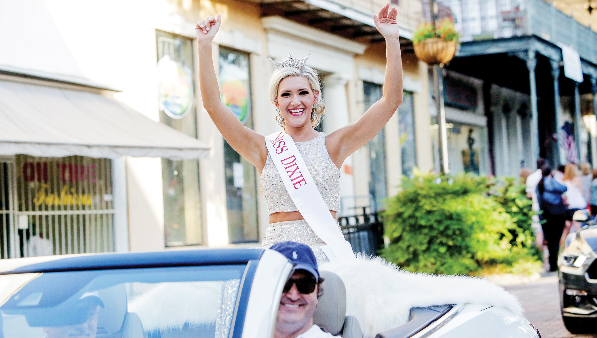 Photo by Alaina Denean Deshazo — The Vicksburg Post/Miss Dixie Laura Lee Lewis of Brookhaven waves to the crowds this week during the parade of Miss Mississippi pageant contestants. The pageant begins tonight in Vicksburg, where Lee’s group will compete in the talent portion of the competition.