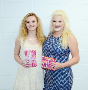 The Brookhaven Academy Cheer squad was honored during their spring athletic banquet. Two senior cheerleaders (from left) Leah Case and Whitney Moak received gifts.