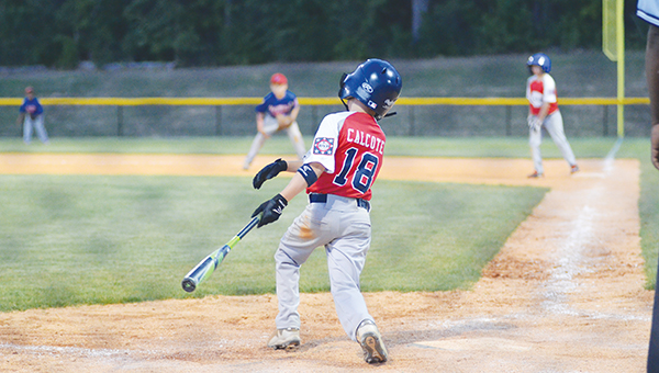 Photo by Anthony McDougle/ Lincoln American All-Stars’ left center fielder Wilson Calcote follows through on his swing in Saturday’s contest against Walthall at the Lincoln Civic Center Baseball Complex. The Lincoln Americans won the game 18-16 to force a game three in Walthall on Tuesday.