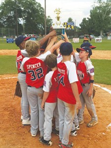 Photo Submitted/ The Lincoln American All-Stars hoist their district championship trophy after defeating Walthall 10-3 in game three of the series.