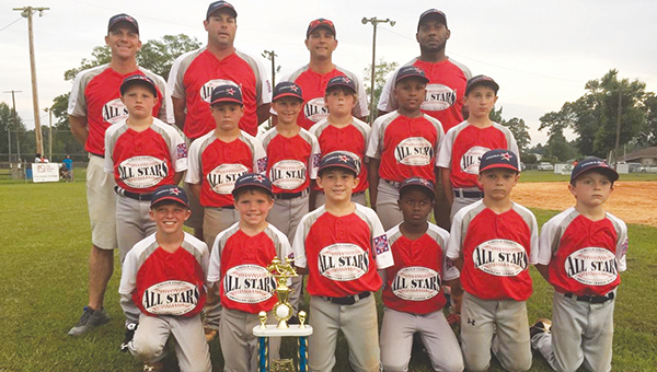 Photos Submitted/ The 8-year-old Lincoln American All-Stars smile with their trophy after a victory in game three over Walthall. Members of the team are Glenn Lewis, Seth DeGeorge, Carter Palmer, D.J. Washington, Wilson Calcote, Cole Spencer, Dawson White, Graham Smith, Ladarious Jackson, Bram Wolfe, Walker Brady and Casen Easterling. The Americans head coach is Shane Easterling. Assistant coaches are Colby Calcote, Jaymie Palmer and Durrell Washington.