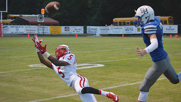 File photo/ PrimeTime 23 sophomore wide receiver James Beard stretches out to reel in a catch during a game last season.