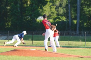 Photo by Anthony McDougle/ Loyd Star pitcher Stephen Mills tries to catch a runner stealing a lead on first base. Loyd Star lost the contest to Bogue Chitto 9-8 Thursday at the Lincoln Civic Center Baseball Complex.