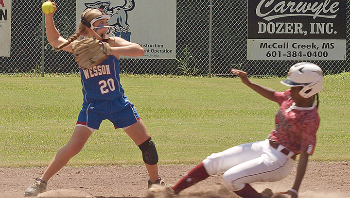 Wesson second baseman Arie Douglas tags out a Lawrence County baserunner and prepared to make a throw to first during the Cobras’ 5-2 victory over the Cougars Saturday.
