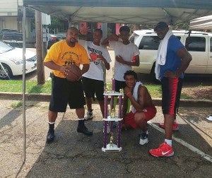 Photo submitted/ Coach Sgt. Damian Gatlin (left), Landon Gatlin, Matthew Hall, Lonnie Lenoir Jr. and  Lonnie O'Neal Lenoir won the Hoopfest championship for the 18-and-up age group 
