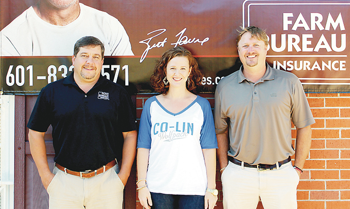 Photo submitted/Lincoln County Farm Bureau agents and Co-Lin graduates Chuck Owens (left) and Keith Cline (right) are pictured with Co-Lin Associate Director of Alumni Affairs Angela Furr. The Lincoln, Lawrence, and Copiah County branches of Farm Bureau are partnering with the Co-Lin Alumni Association to sponsor a tailgate party on Thursday, Sept. 22, at Stone Stadium from 5:30 to 7 p.m.