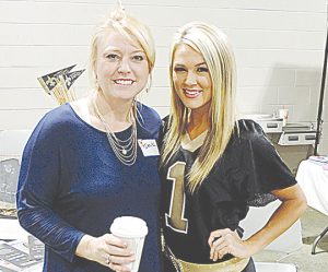 Brookhaven Animal Rescue League volunteer Deana Pendley (left) visits with Saintsation Summer Rials with the New Orleans Saints at last year’s celebrity dinner. Rials was a special guest at the 2015 event.