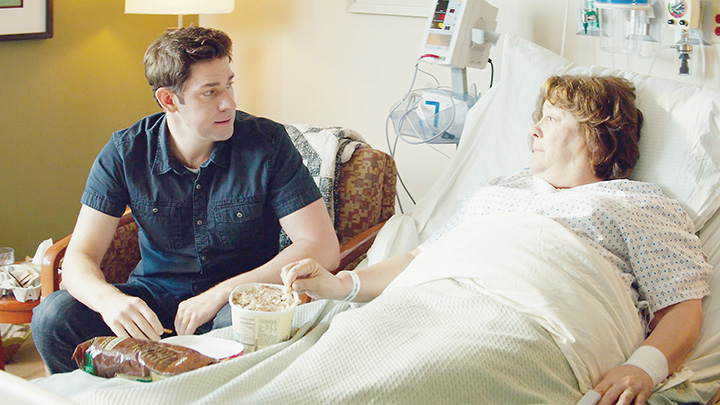 Photo courtesy of Sony Pictures Classic/John Krasinski (left), who stars as John Hollar in the movie “The Hollars,” sits with Margo Martindale , who portrays Sally Hollar, in a King’s Daughters Medical Center hospital room during a scene shot in 2014.