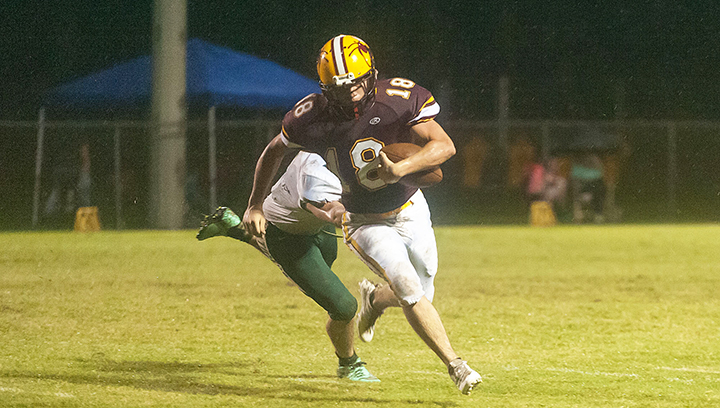 Photo by Teresa Allred/ Enterprise’s Brady Williams tries to shake off a McLaurin defender in the Yellow Jackets’ homecoming game against the Tigers Friday night.
