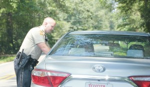 Photo by Alex Jacks/Lincoln County sheriff’s deputy Ian Smith makes a traffic stop while patrolling the county Friday.  