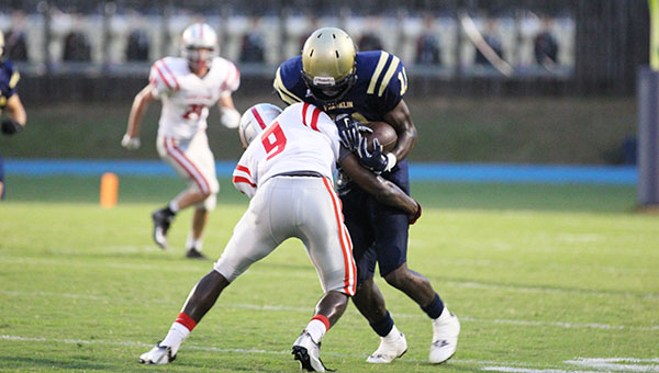 Photo by Amy Rhoads/ Loyd Star Hornets’ defensive back and wide receiver Patrick Price wraps up a Franklin County runner in the Hornets 38-6 road loss Friday.