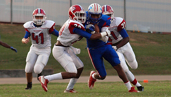 Photo by Tracy Fischer/ Wide receiver/safety Randy Hooker is tackled by Seminary defenders during their game Friday night in Wesson.