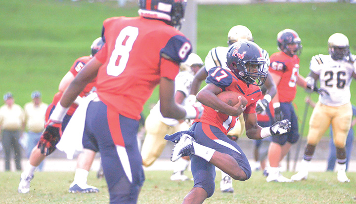 Photo by Anthony McDougle /Ole Brook quarterback Sevante Quinn looks for running room against the Franklin County Bulldogs.
