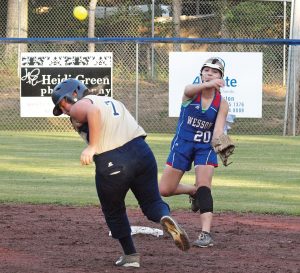 Photo by Tracy Fischer/Wesson second baseman Arie Douglas tags out Bogue Chitto’s Savannah Frith  and makes a throw to first in a meeting between the team’s earlier this season.