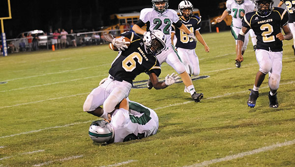 Photo by Teresa Allred/ Bogue Chitto running back Terrance Morgan is wrapped up by a West Lincoln defender in the Bobcats 40-6 loss to the Bears Friday night.