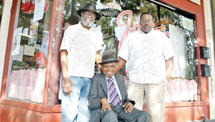 Photo by Aaron Paden/O Foundation Treasure A. C. Herring (left), Robert “Mr. Pete” Byrd and Race to Fitness organizer Elisa Corely gather for a photo Friday in front of Janie’s Pastry. Byrd has been described as a community icon and was chosen as the O Foundation’s 2016 VIP.