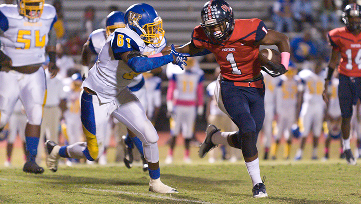 Photo by Teresa Allred/Ole Brook’s Damarrell Legget pushes past a Wingfield defender. The Panthers went on to vanquish the Falcons, securing a playoff berth.